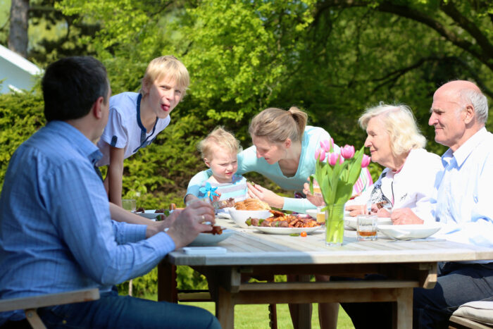 Baby at Dinner Table with Family