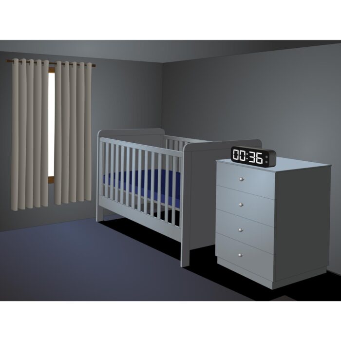 A cot in a dark bedroom. How dark should the baby's nursery be?