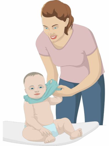 Mother taking baby's t-shirt off