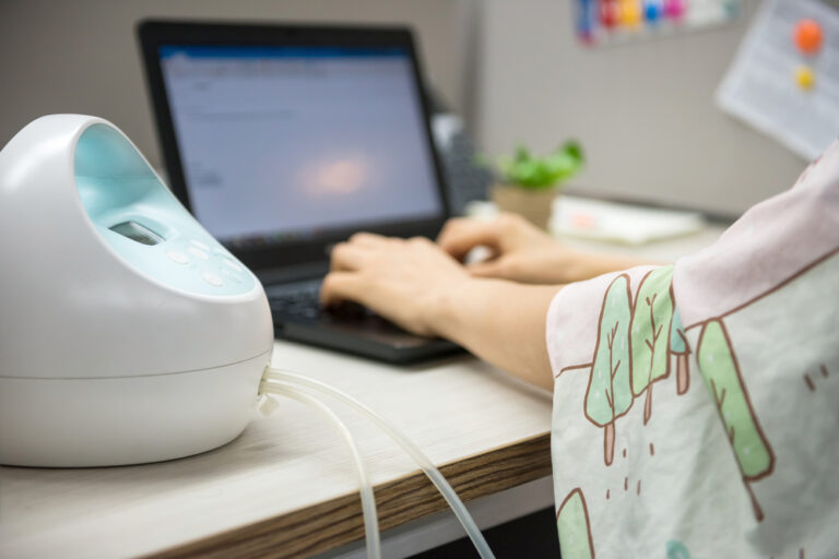 women pumping with Spectra breast pump at work