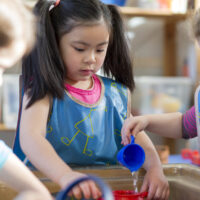 children playing with water table