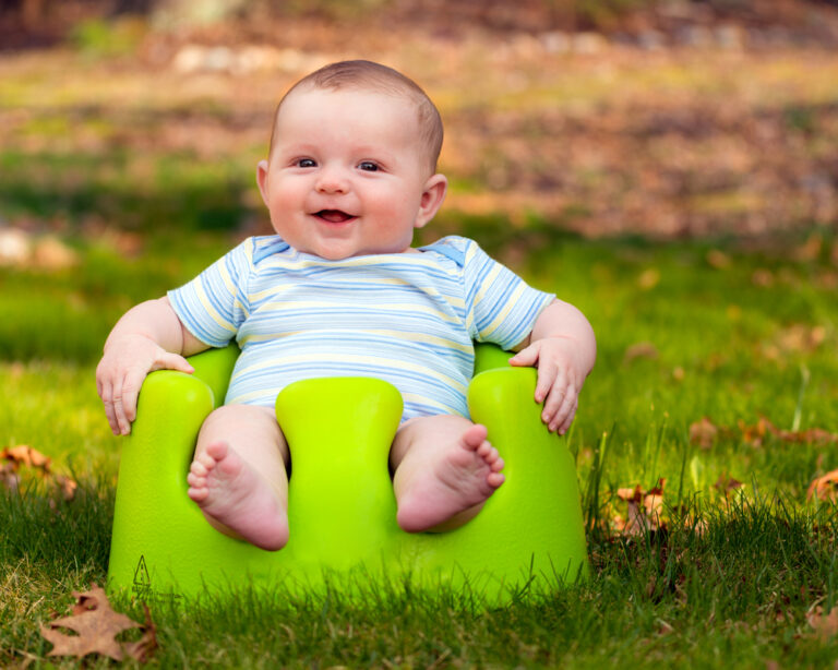 Happy Baby Boy in Bumbo Seat