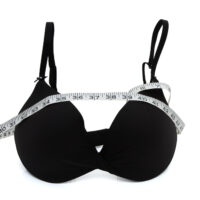 black bra with measuring tape around it