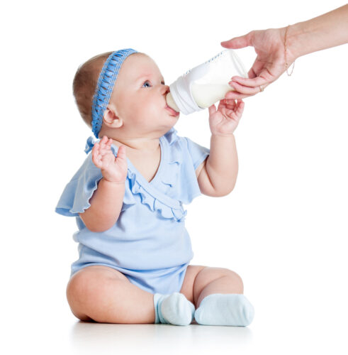 baby drinking from a bottle