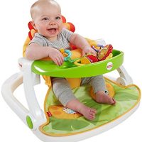 image of child with the fisher price sit me up floor seat