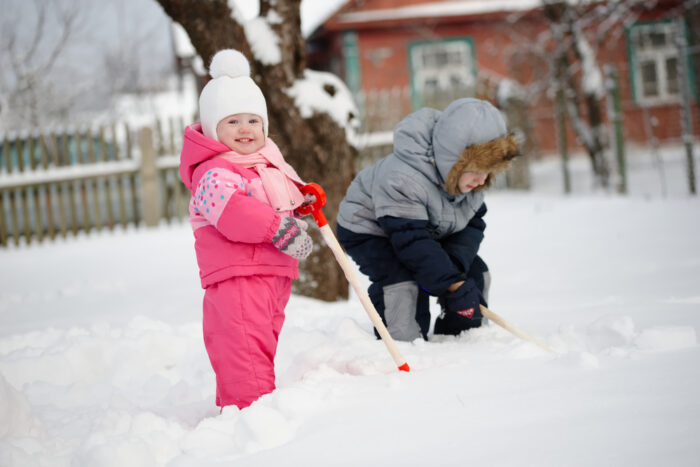 toddlers playing in the snow