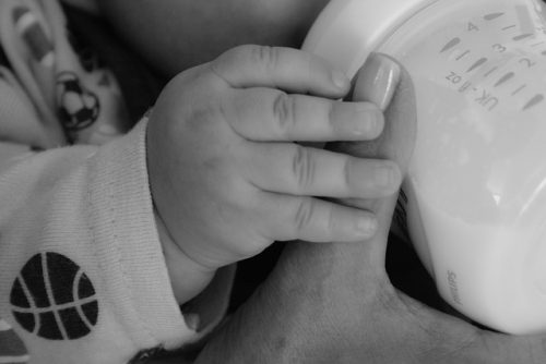 Picture of a baby bottle feeding