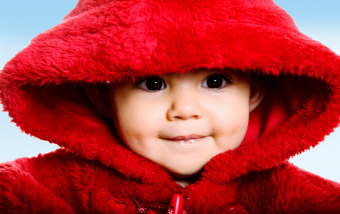 Baby in furry coat due to cold weather