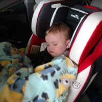 baby sleeping in evenflo symphony car seat