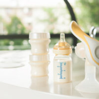 manual breast pump sitting on a table