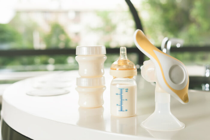 manual breast pump sitting on a table