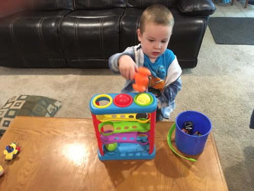 2 year old playing with the Playkidz toy