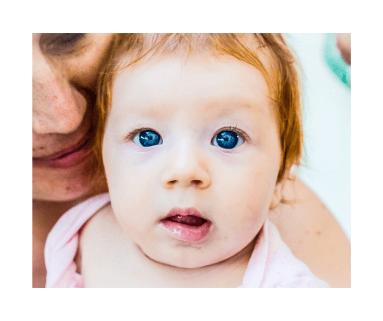 red hair, blue eyed baby girl with her mom