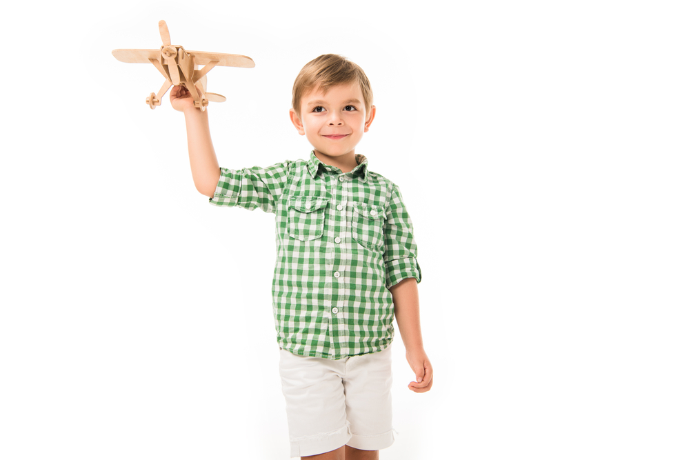 5 year old boy playing with airplane