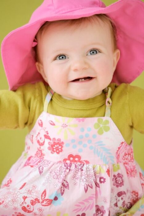 baby in pink sun hat