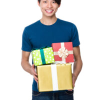14 year old boy holding gifts