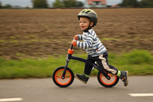 kids riding balance bikes