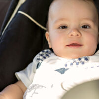 Happy Baby sitting in car seat