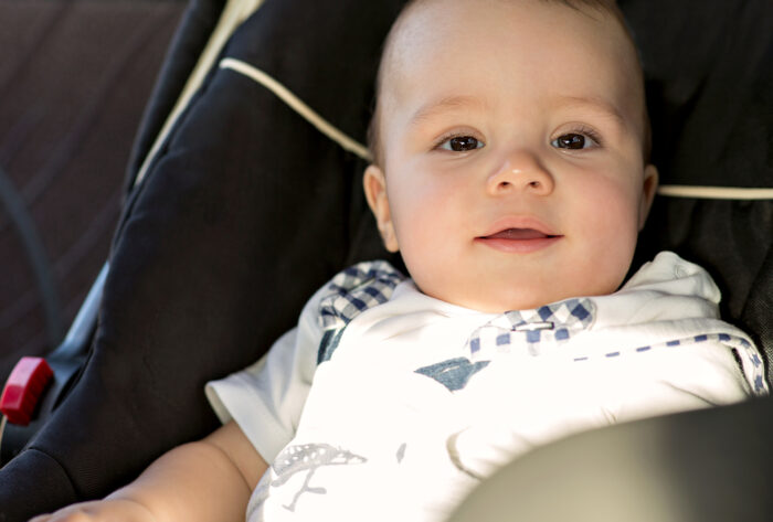 Happy Baby sitting in car seat