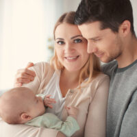 Mom and Dad with newborn baby