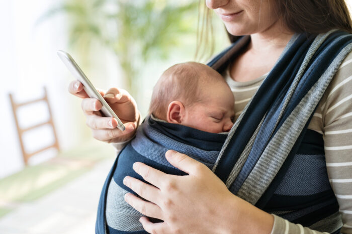 baby facing mom in a baby carrier wrap