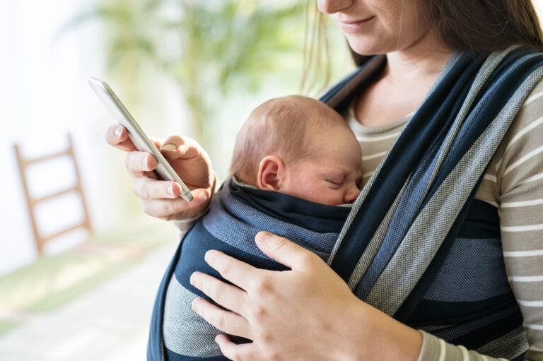 baby facing mom in a baby carrier wrap