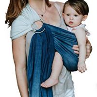 woman holding baby in a ring sling