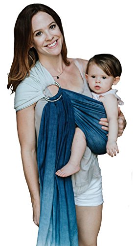 woman holding baby in a ring sling