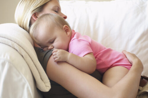 woman-with-a-sleeping-baby