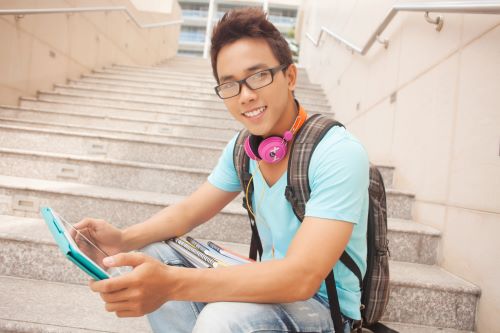 15 year old boy with tablet