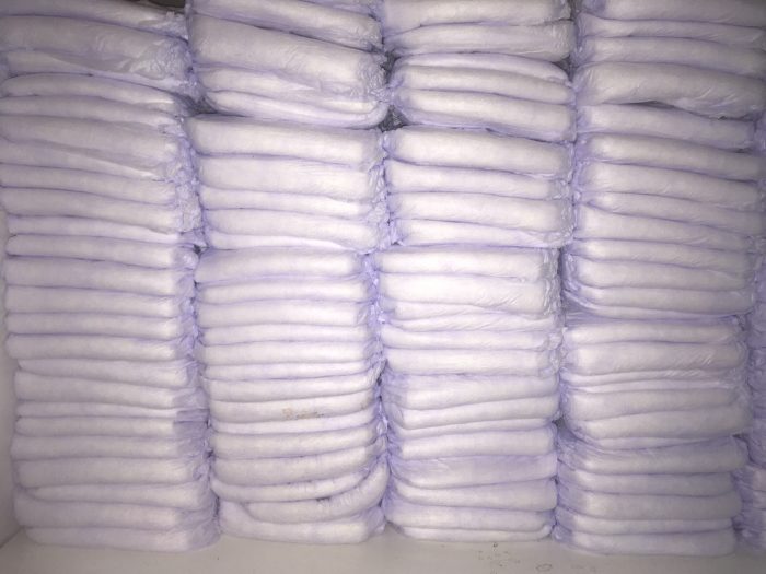 How much do diapers cost? A shelf with stacks and stacks of diapers