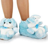 A child's legs in furry bunny slippers