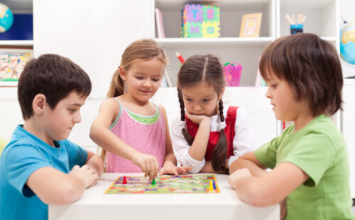 kids playing a board game together