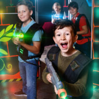 young boys playing laser tag