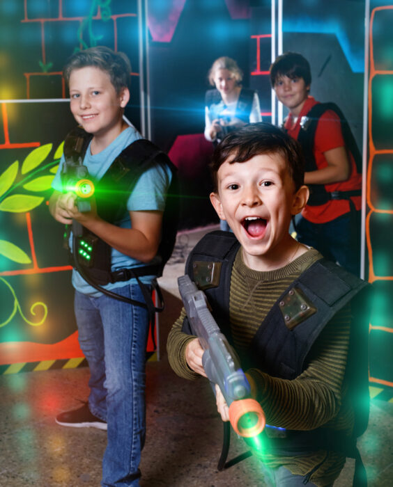 young boys playing laser tag