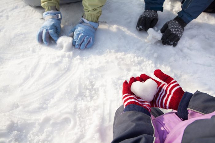 toddler hands with gloves in snow