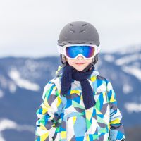 child wearing ski helmet