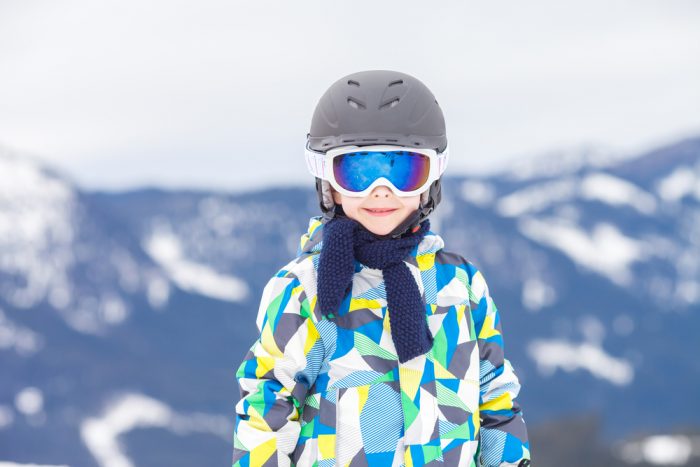 child wearing ski helmet