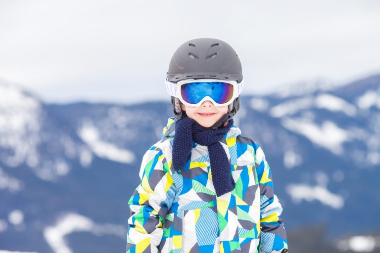 child wearing ski helmet