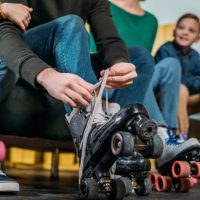 kids putting on roller skates