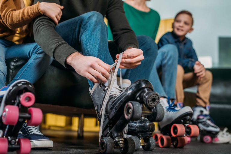 kids putting on roller skates