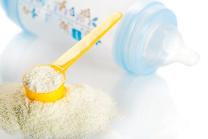 baby formula with measure and a bottle