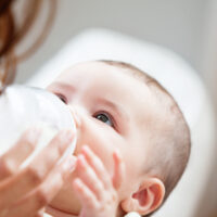 baby drinking from bottle