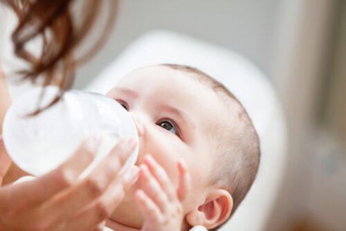 baby drinking from bottle