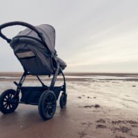 All terrain stroller on the beach in the sand