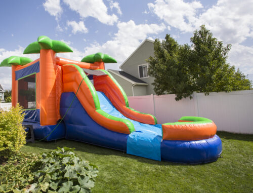 inflatable water slide in a backyard