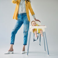 Cropped Mom with Baby in Stokke High Chair