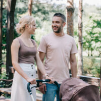 Mom and Dad Walking Baby in Stroller