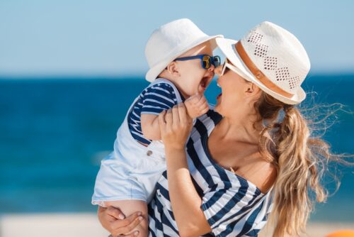 Baby and Mom at the beach in their beachwear