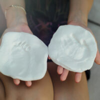 Molds of baby hand and foot prints